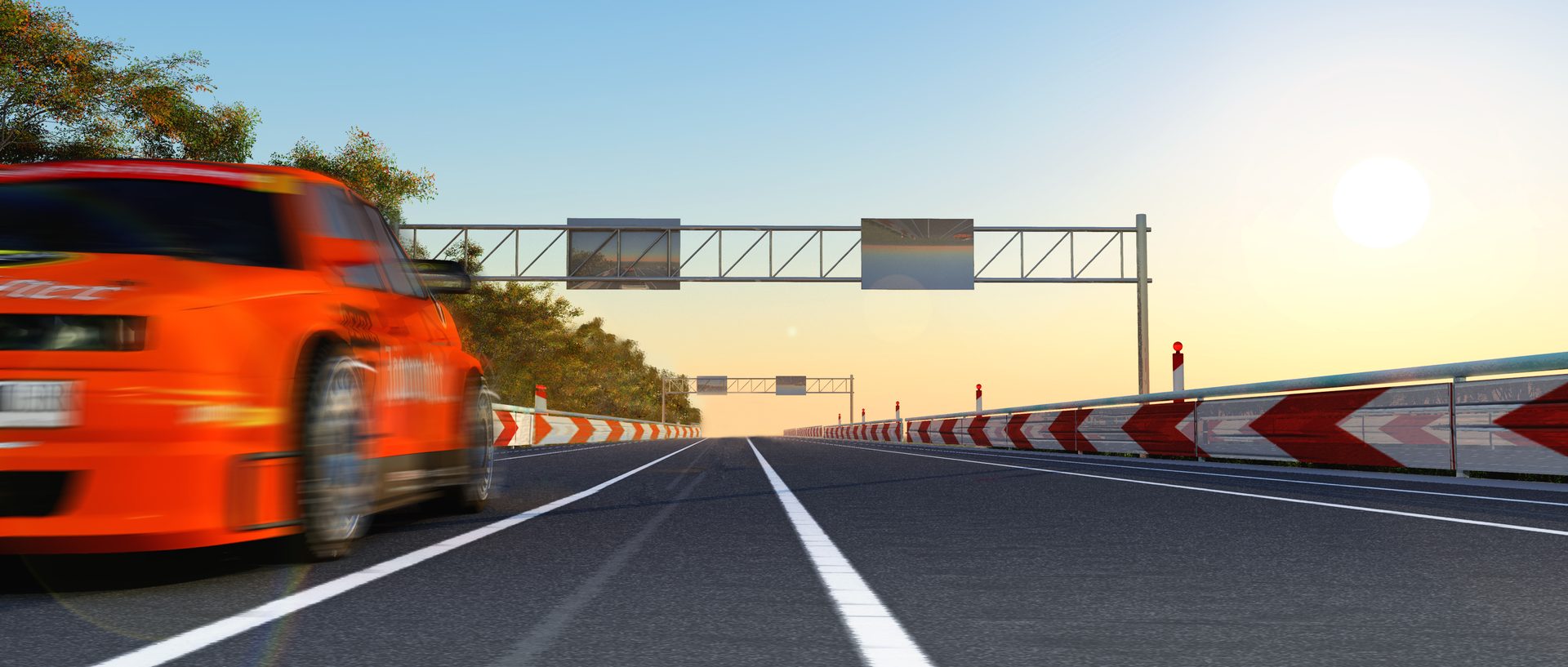 A race car on a circuit at sunset