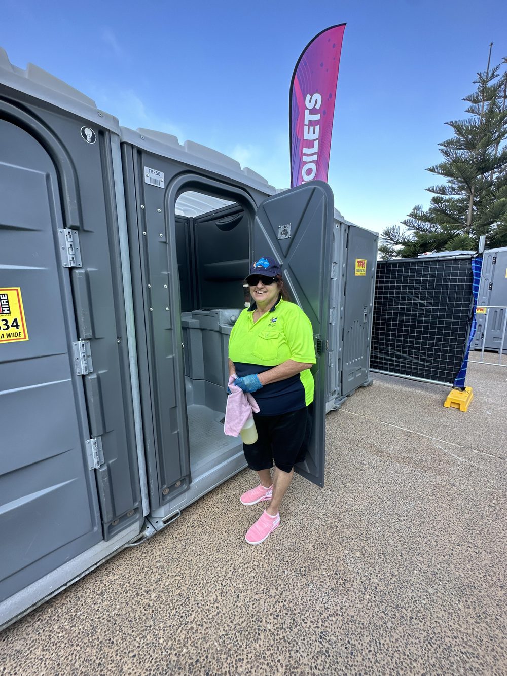 A Wilclean crew member servicing event amenities